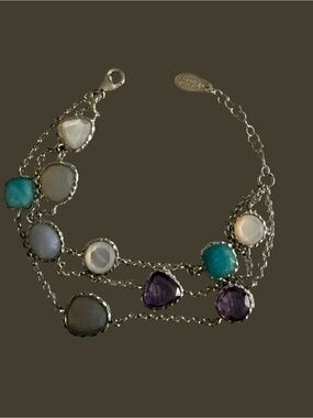 Frederic Duclos bracelet features a delicate sterling silver chain bracelet